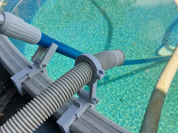 Swimming pool - handheld vacuum cleaner holder